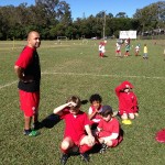 Former A league player Owen Filewood takes some time out with kids at a session.