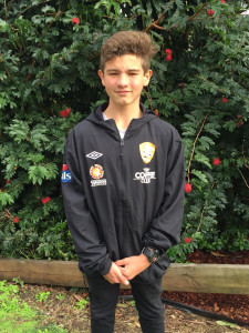 James Hansen wearing his winning Prize after winning the U13s-14s penalty competition.